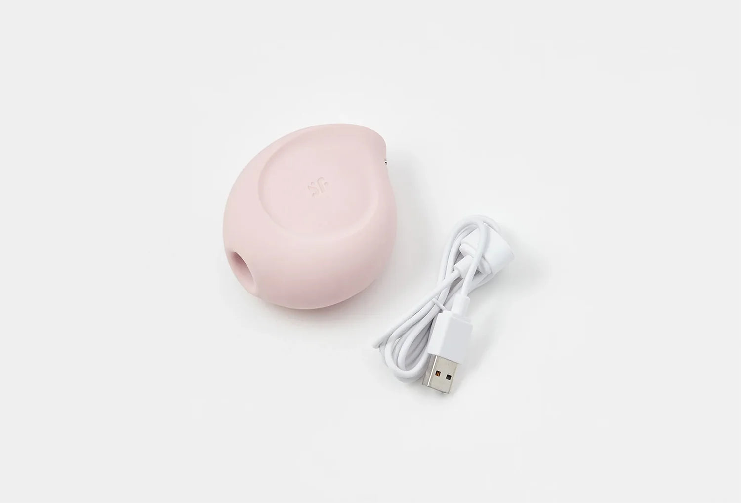 Sugador de clitóris Satisfyer Sugar Rush em silicone de cor rosa claro — vista de cima com cabo usb