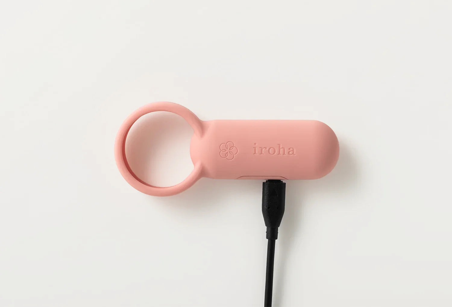 Vibrador clitoriano Iroha SVR em silicone de cor rosa velho — vista de cima com cabo carregador